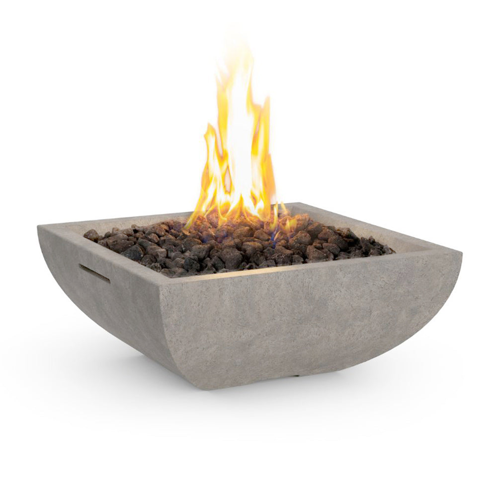 Square gas fire bowl with glowing flames and dark fire media, medium gray GFRC finish