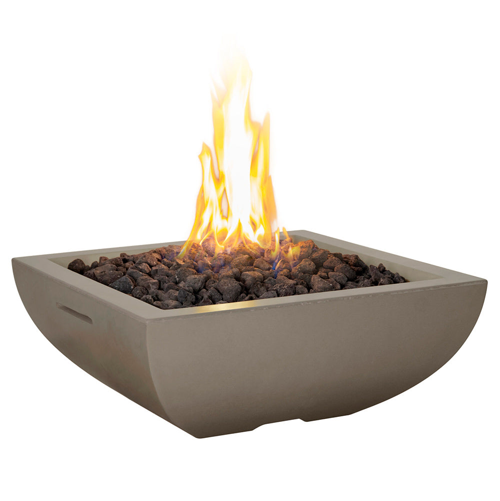 Square gas fire bowl with glowing flames and dark fire media, light tan GFRC finish