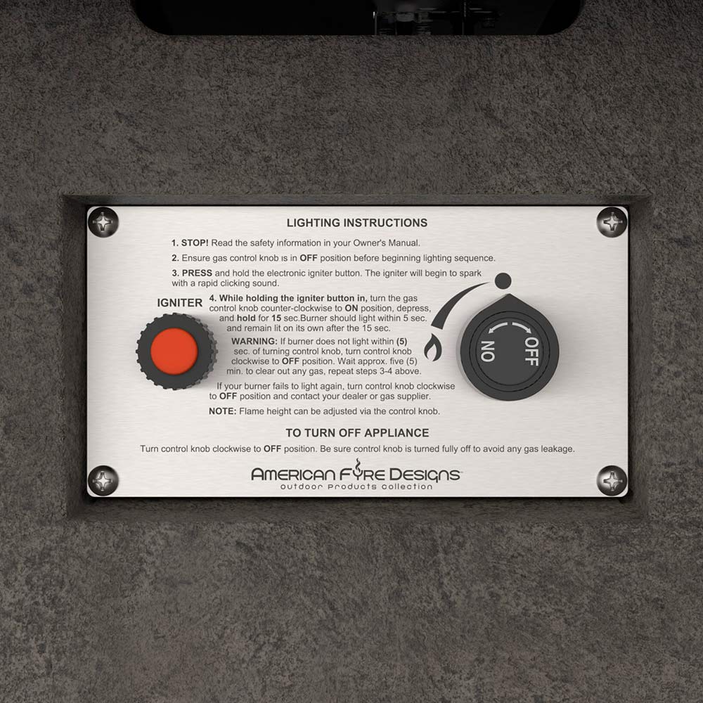 GFRC fire table lighting instructions plate on dark stone surface