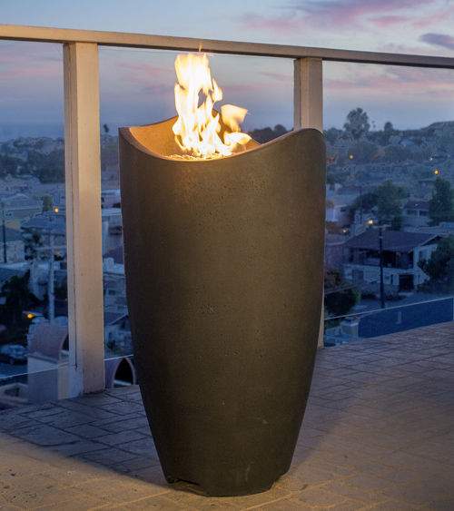 Tall dark fire urn with open top and flames rising from inside