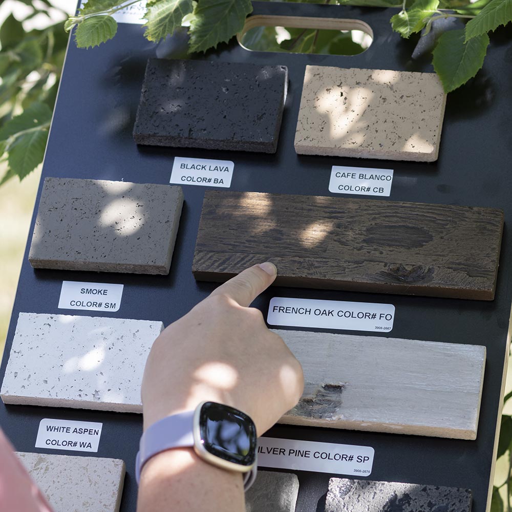 Color sample board with swatches labeled black lava, cafe blanco, french oak, smoke, white aspen, dark basal