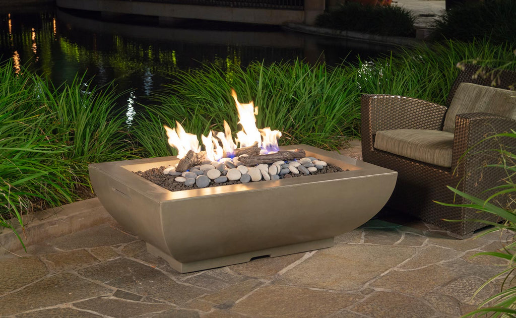 Rectangular fire bowl with beige finish, flames over dark lava rocks