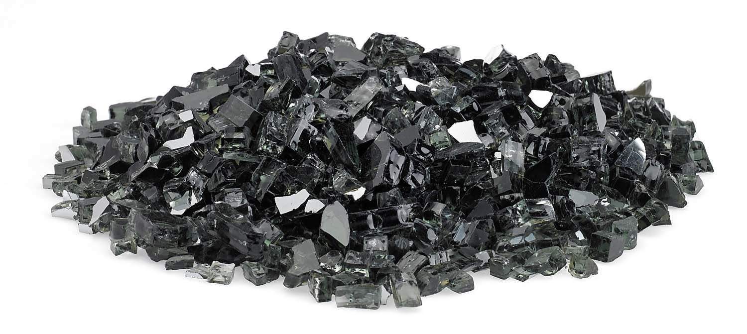 Black reflective fire glass chunks with bright facets in a long pile