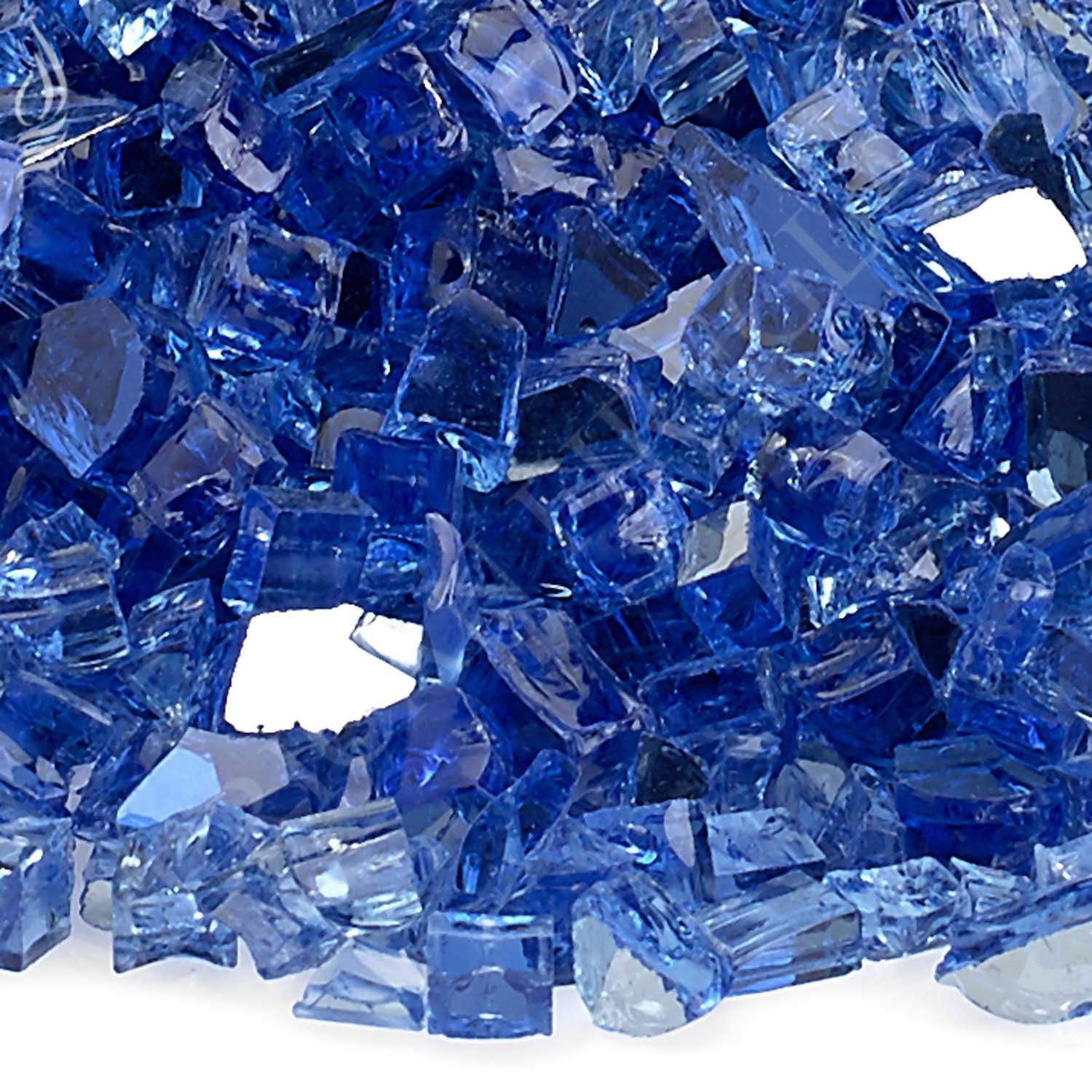 Close-up of cobalt blue reflective fire glass shards and cut chunks