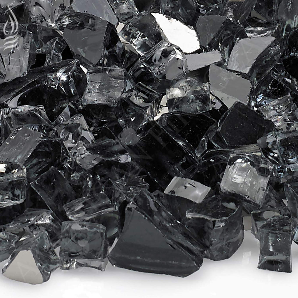 Grey reflective fire glass shards with glossy facets, close-up.