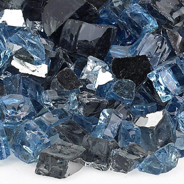 Close-up reflective fire glass pieces, light blue, dark glass, and clear facets