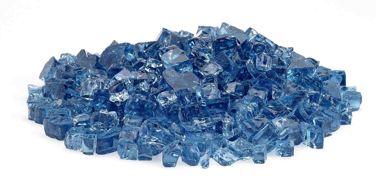 Blue fire glass shards spread across a flat pile, translucent chunky pieces