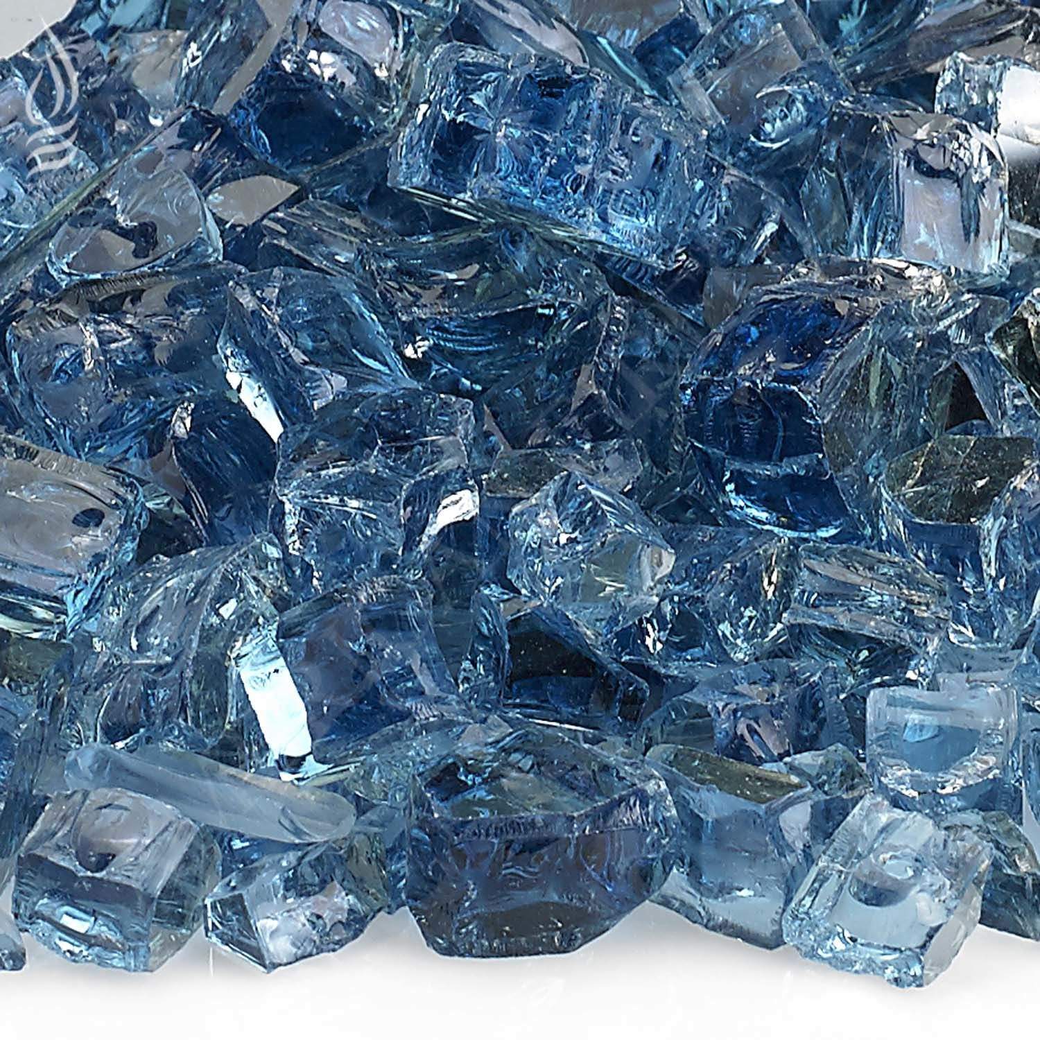 Close-up of blue reflective fire glass chunks with faceted sparkle