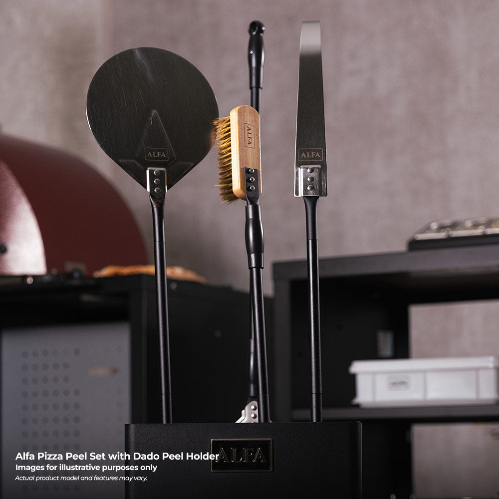 Pizza peel set with round paddle, brush, and two tools standing in holder