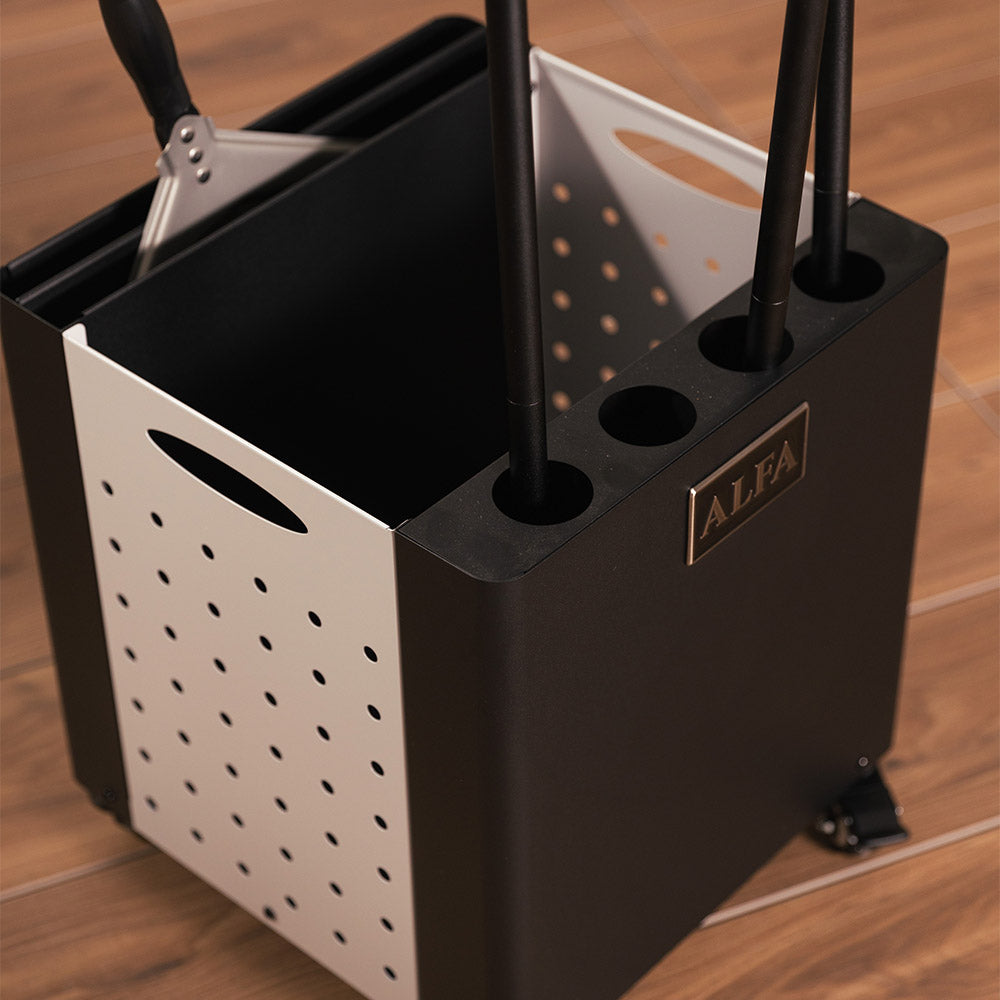 Black and white pizza peel holder with perforated side and round holes for tools