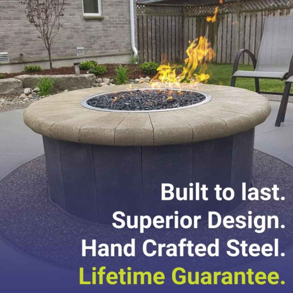 Stainless steel drop-in fire pit pan installed outdoors with visible flames