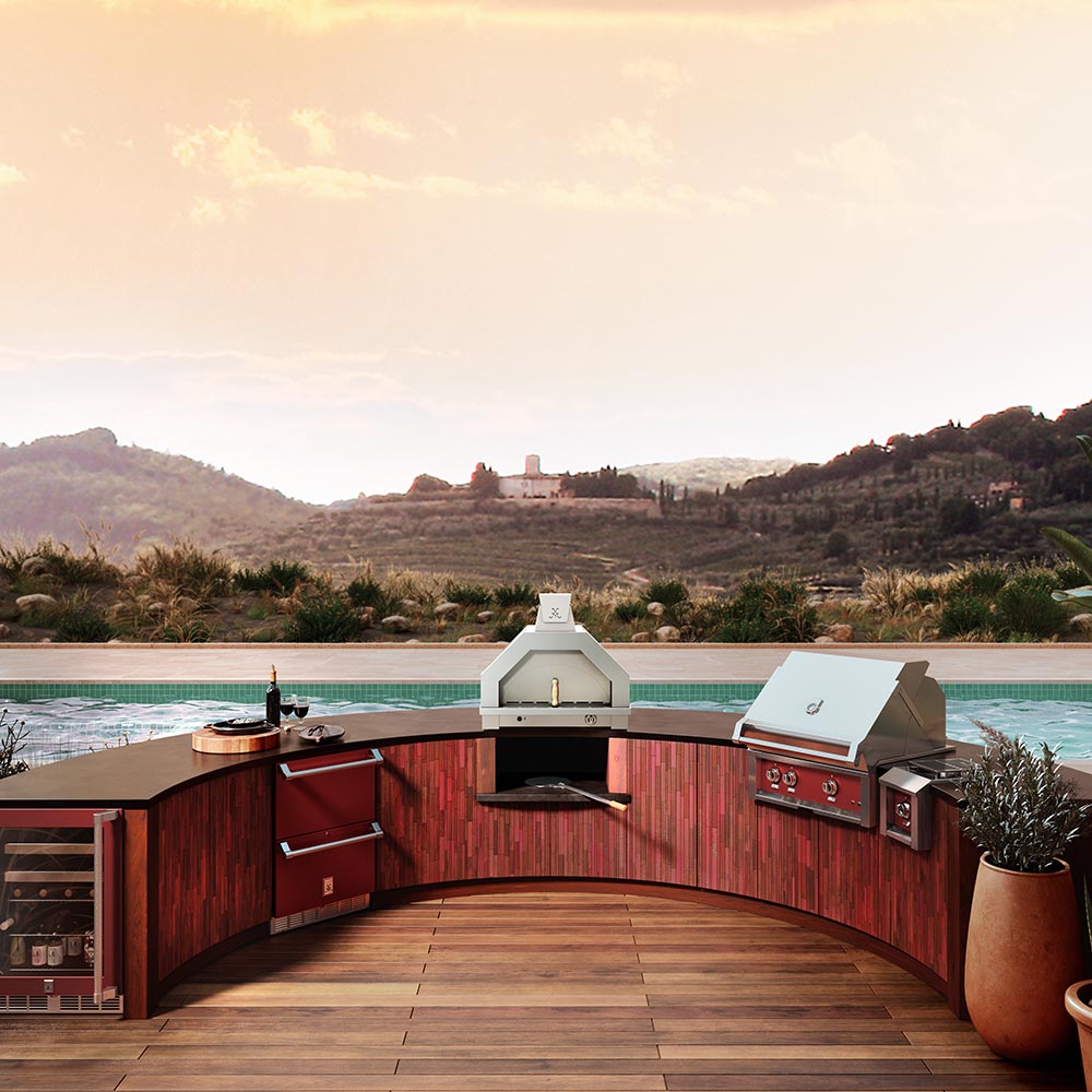Outdoor corner pizza oven setup with built-in counters, shelves, and front control area