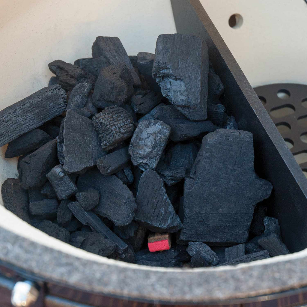 Charcoal pieces loaded inside ceramic firebox bowl