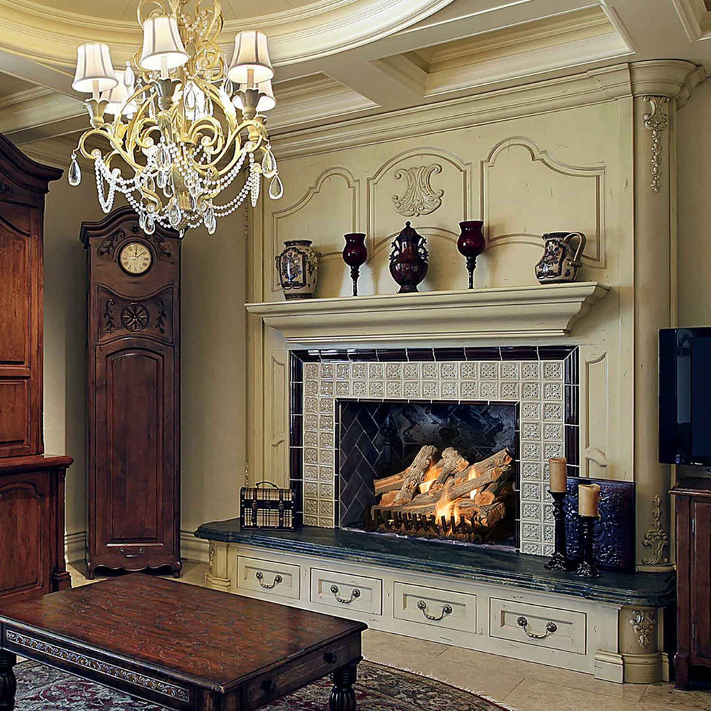 Vented gas log set burning inside a fireplace with stone surround and mantel