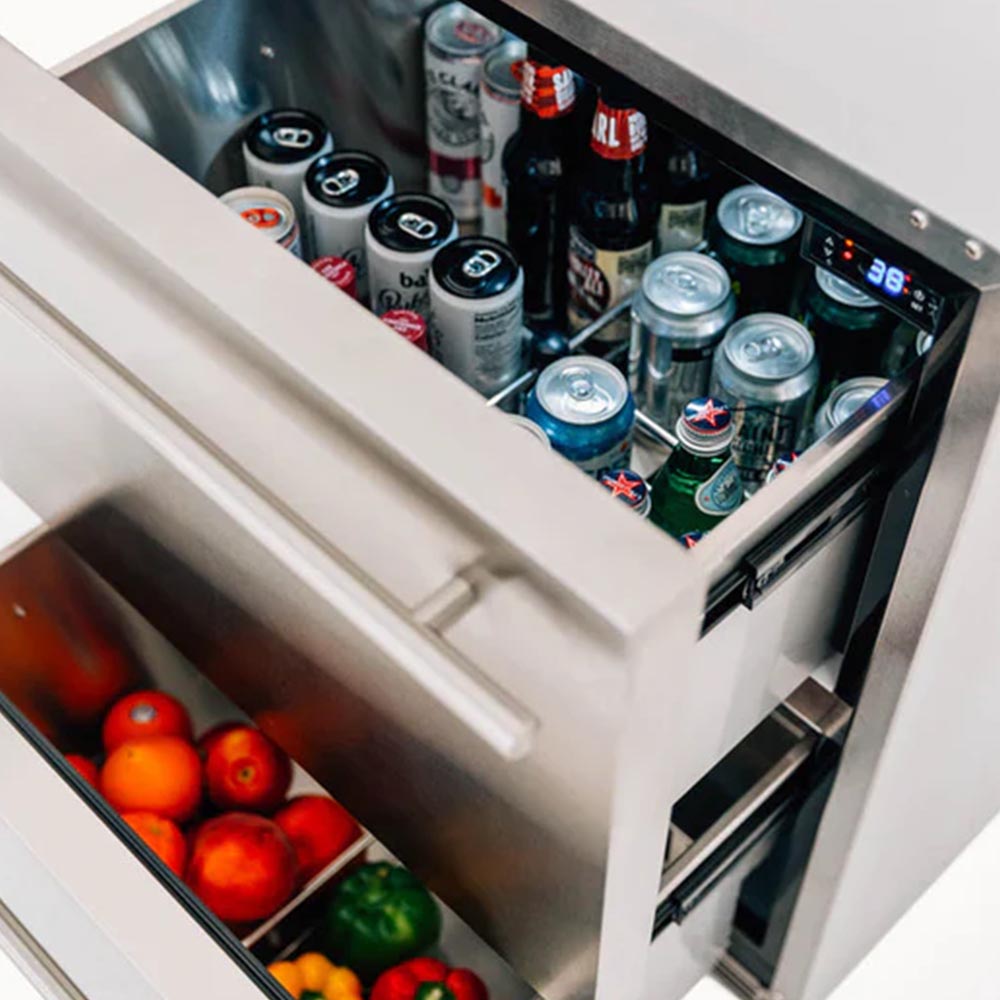 Close-up of open drawer contents with beverage cans and a blue temperature display