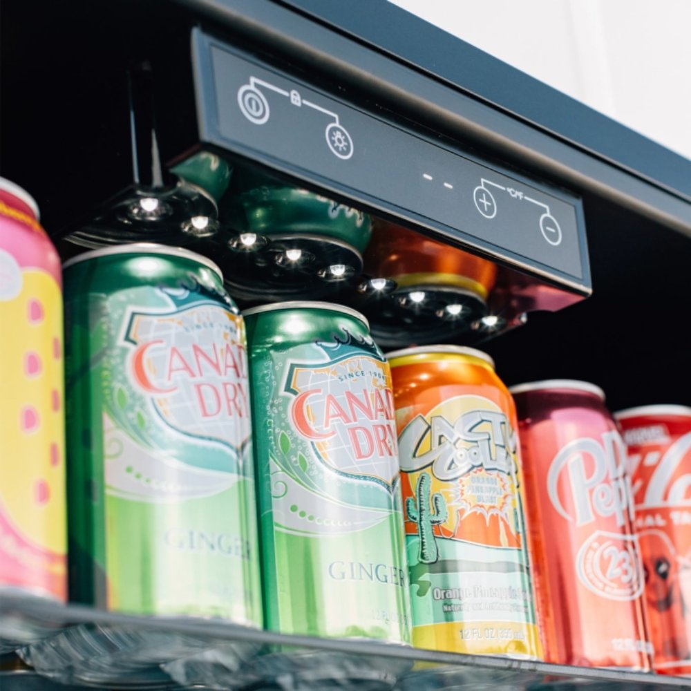 Refrigerator interior with drink cans and digital control panel