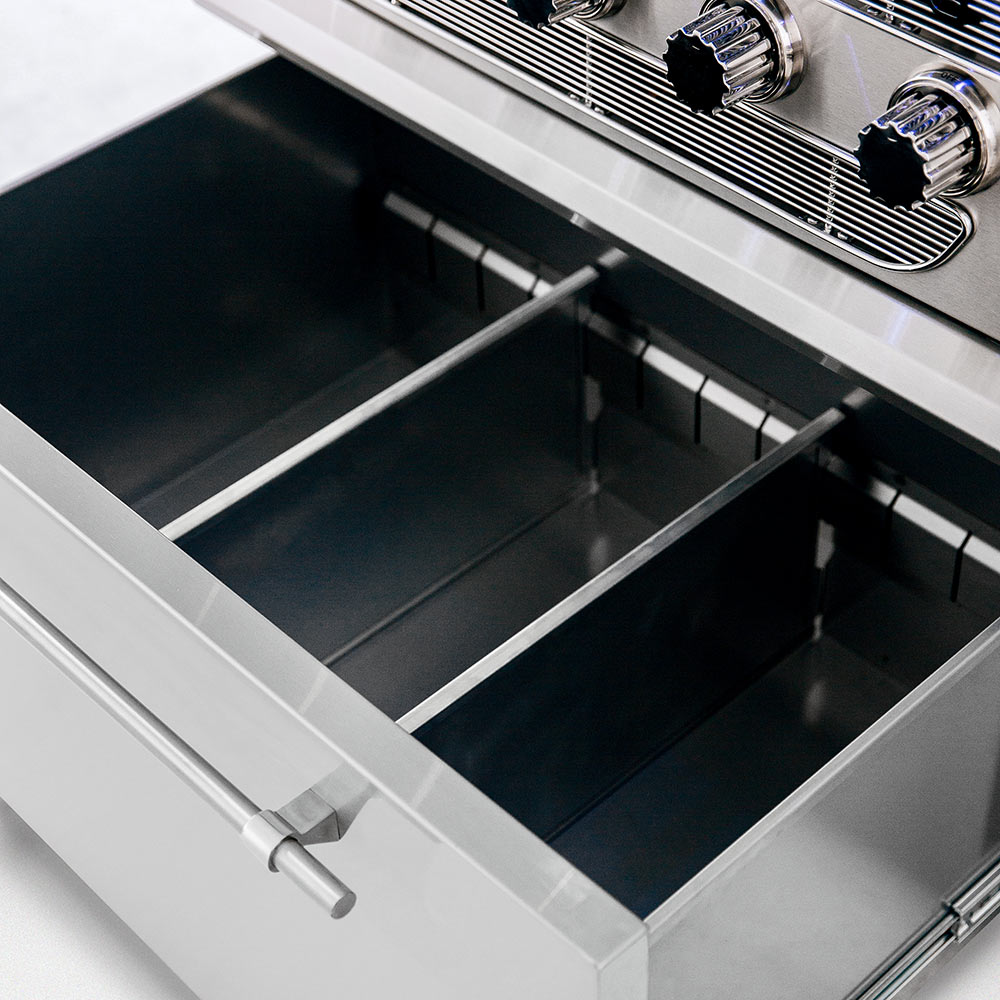 Freestanding grill cart interior with open lid and empty cooking chamber with side rails