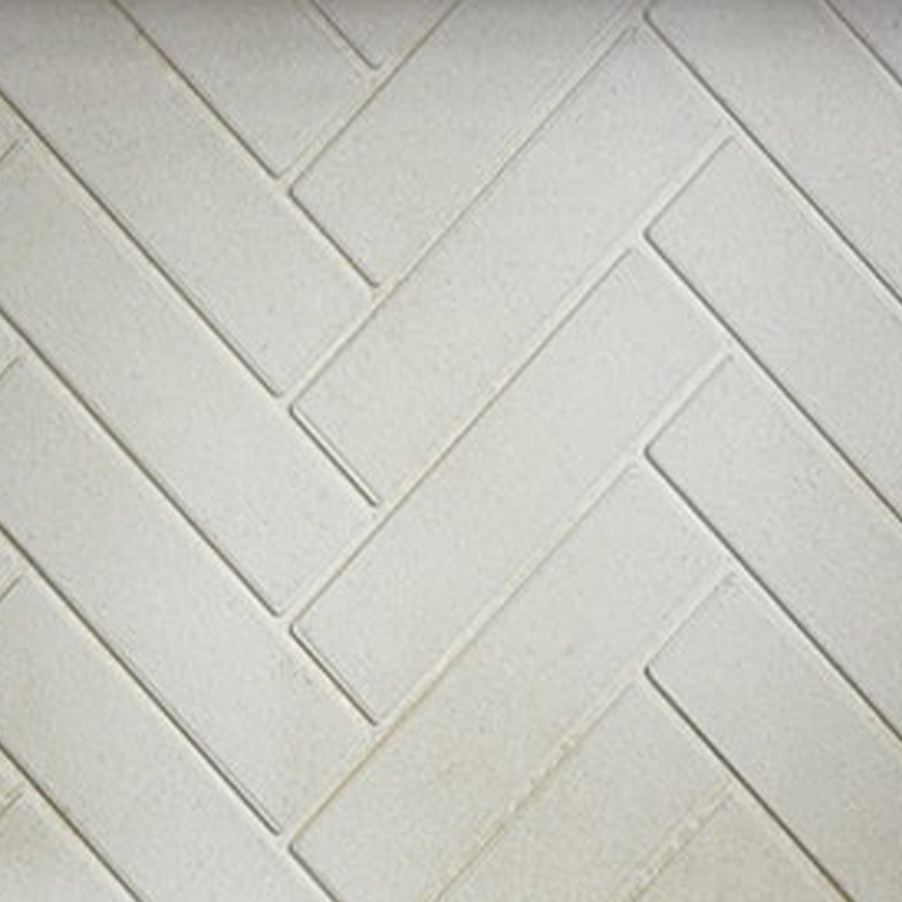 Herringbone brick refractory extension tile with light gray textured pattern