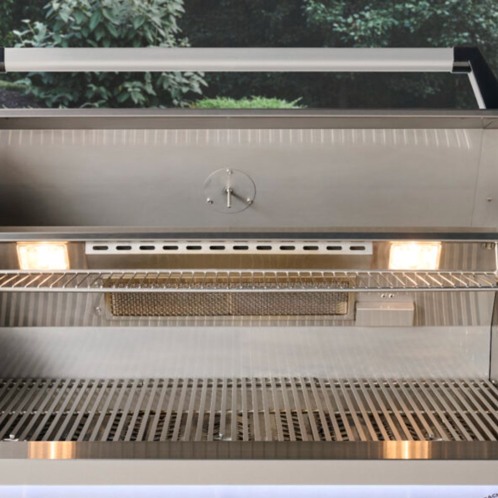 Built-in gas grill with open lid, burner bars, and empty cooking grates