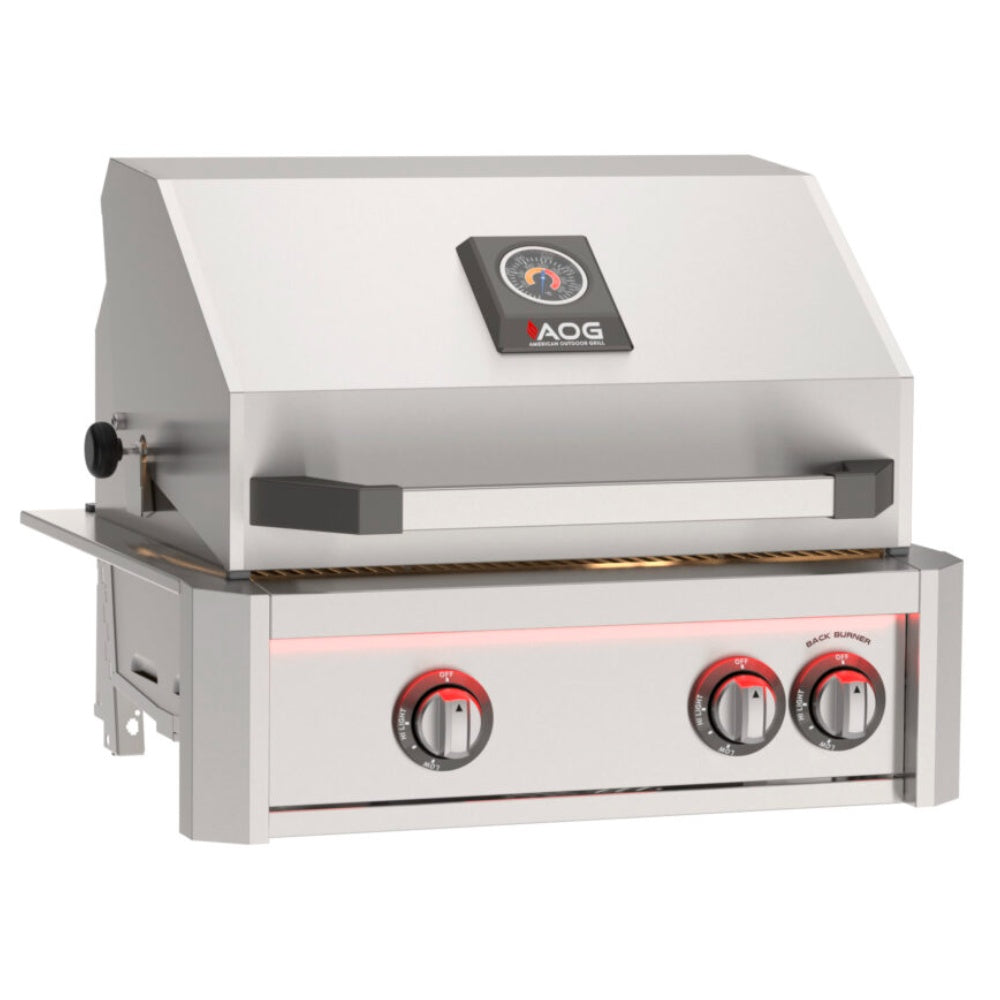 Front view of built-in gas grill with stainless hood and red control knobs
