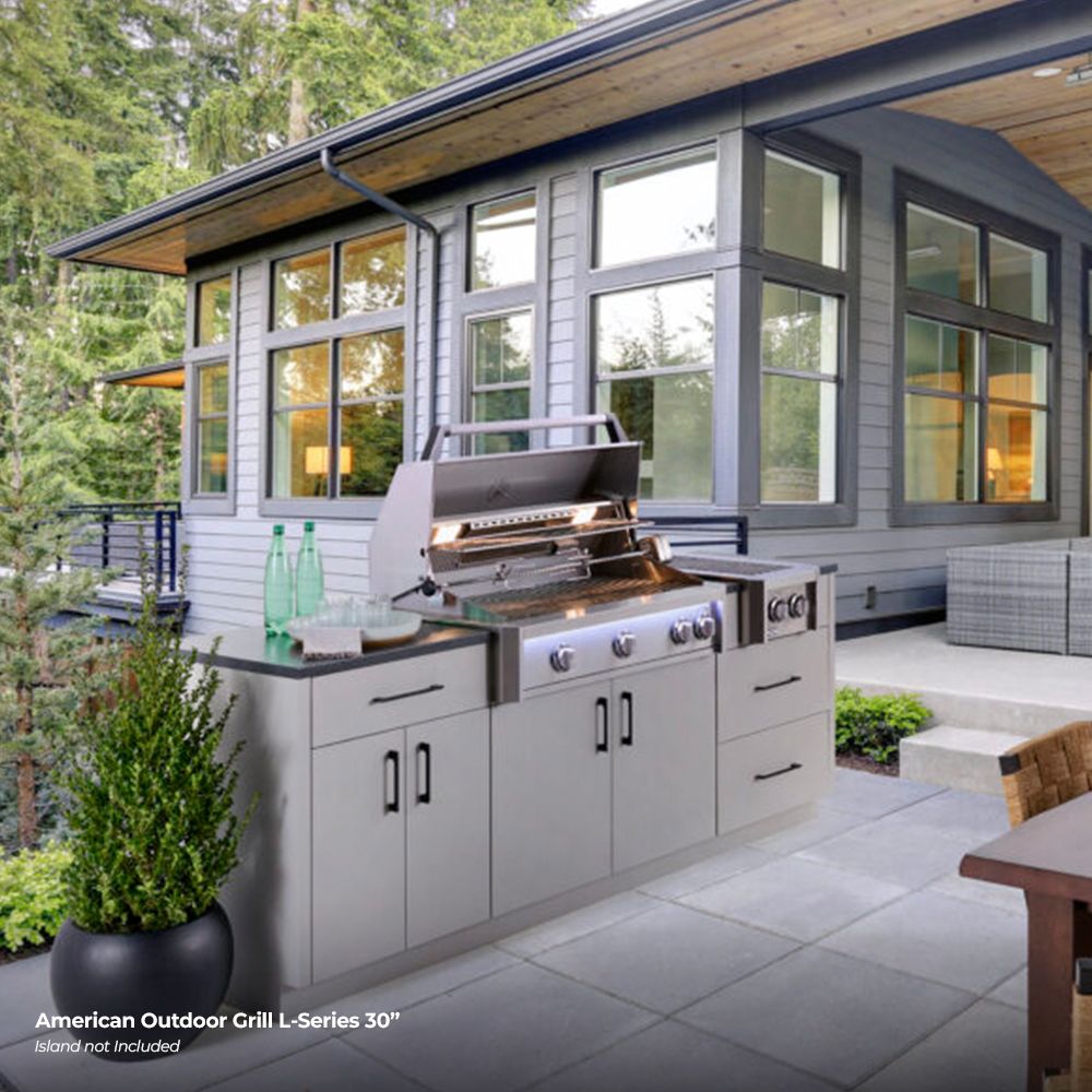 Stainless steel built-in gas grill with side doors and four blue-ring control knobs