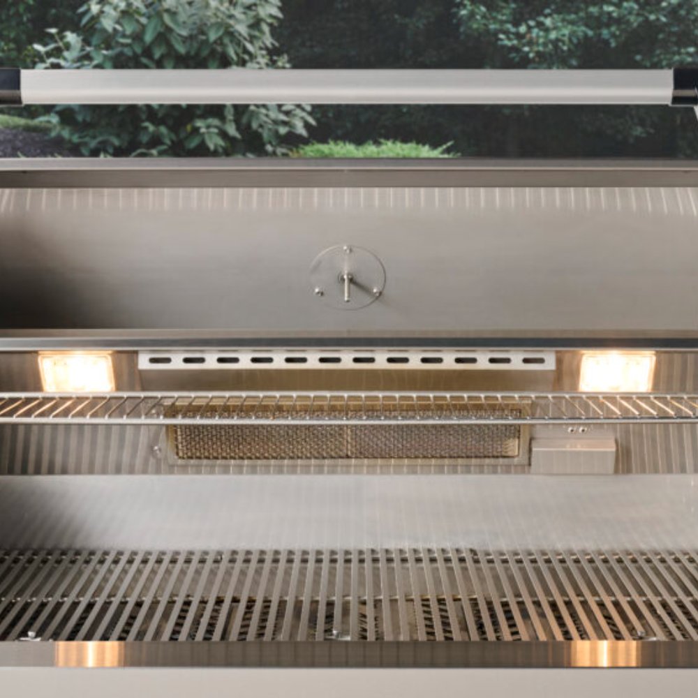 Open built-in gas grill showing warming rack, flame area, and stainless grates