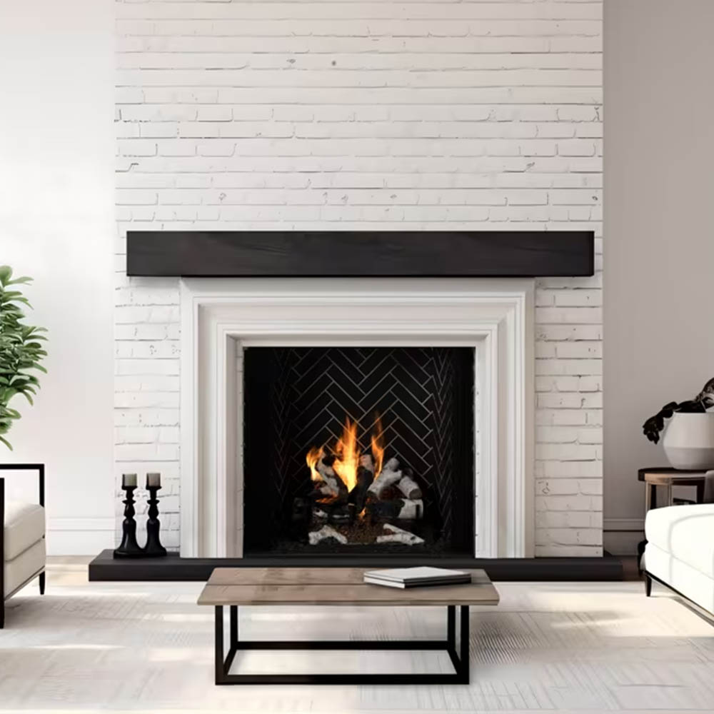 White mantel fireplace with burning logs in a black herringbone firebox