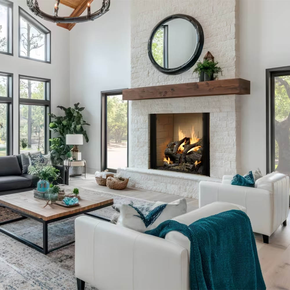 White brick wood burning fireplace with dark firebox and burning logs