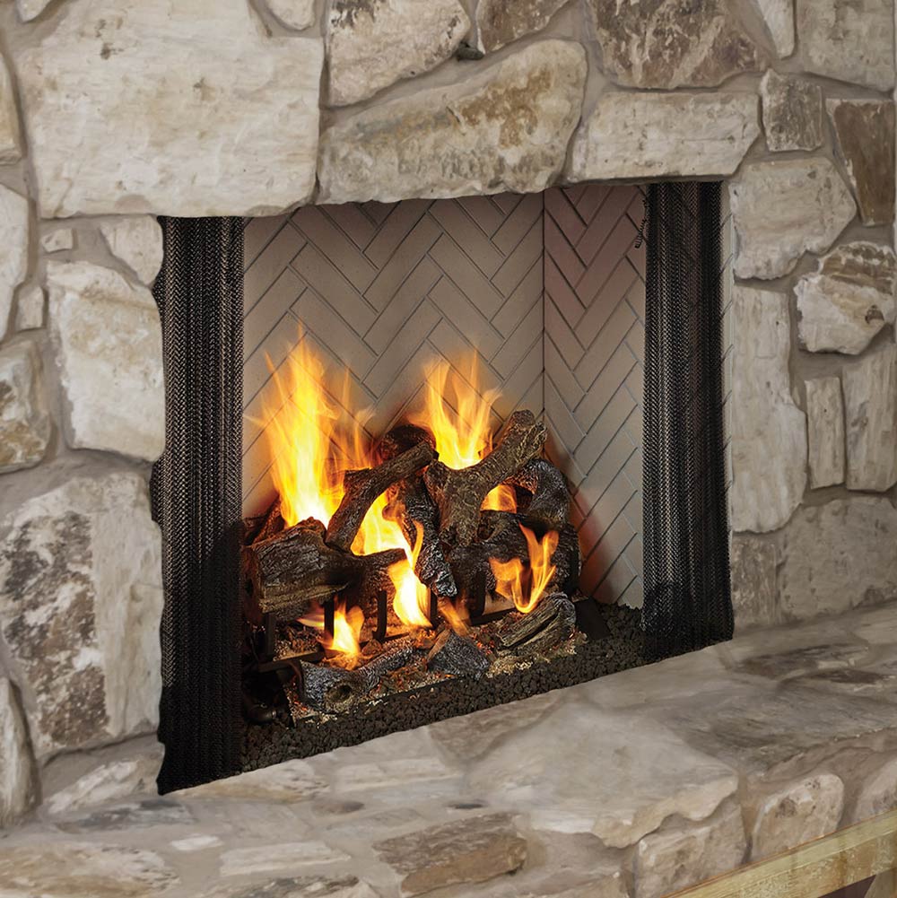 Radiant wood-burning fireplace insert with black mesh sides and burning logs in stone