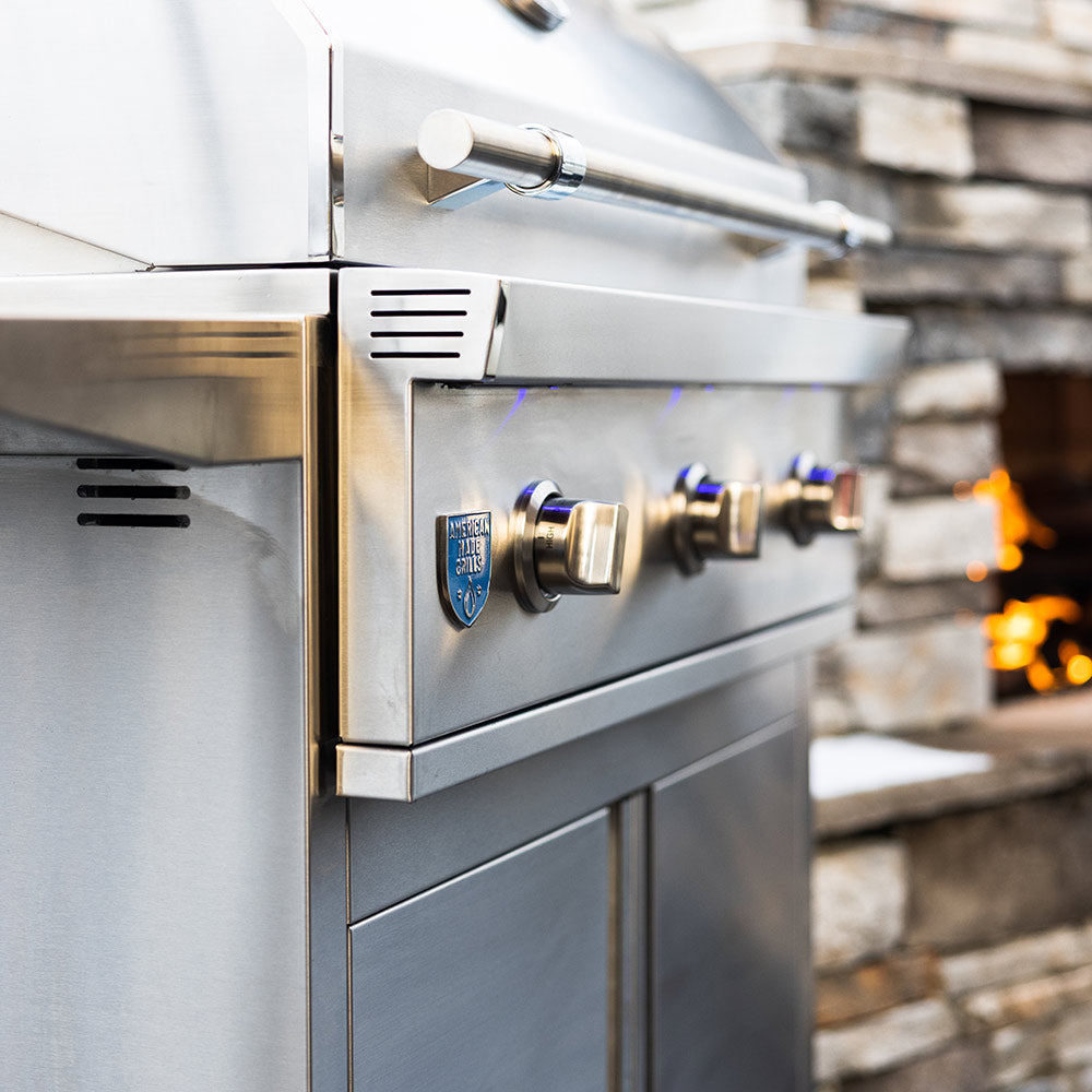 Gas grill control panel with stainless knobs and burner control valve on side