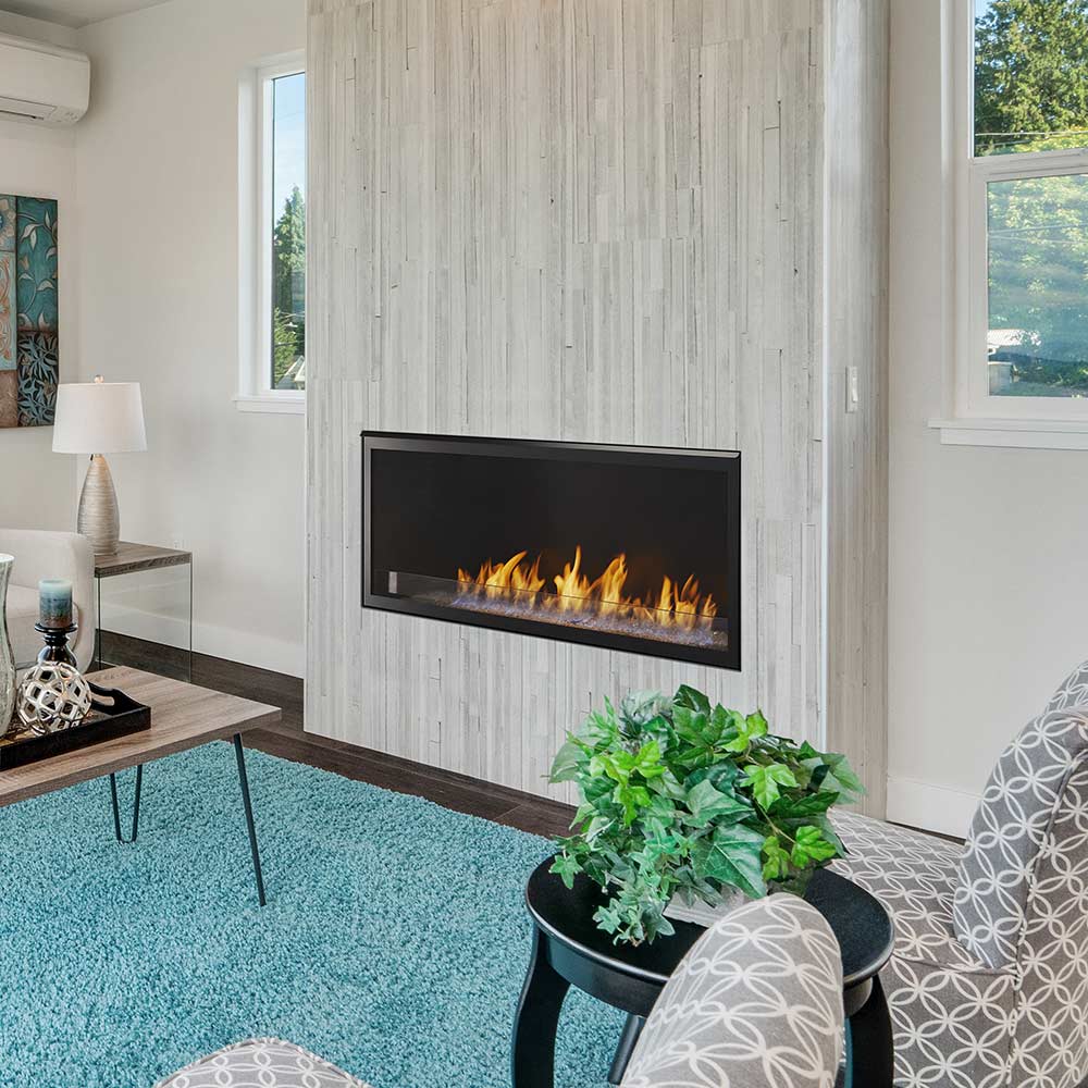 Built-in vent-free gas fireplace with dark trim and burning flames