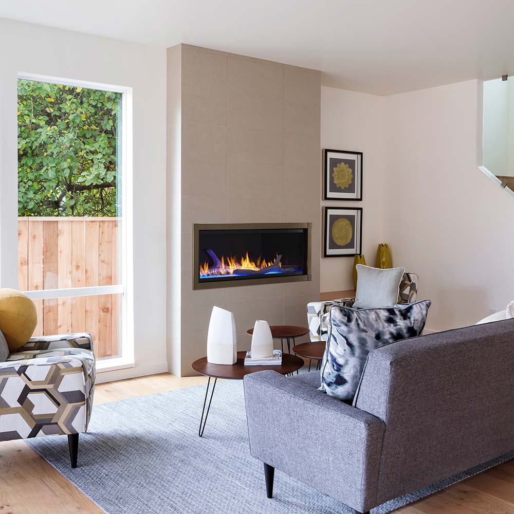 Vent-free gas fireplace with black surround and burning flames in a wall niche