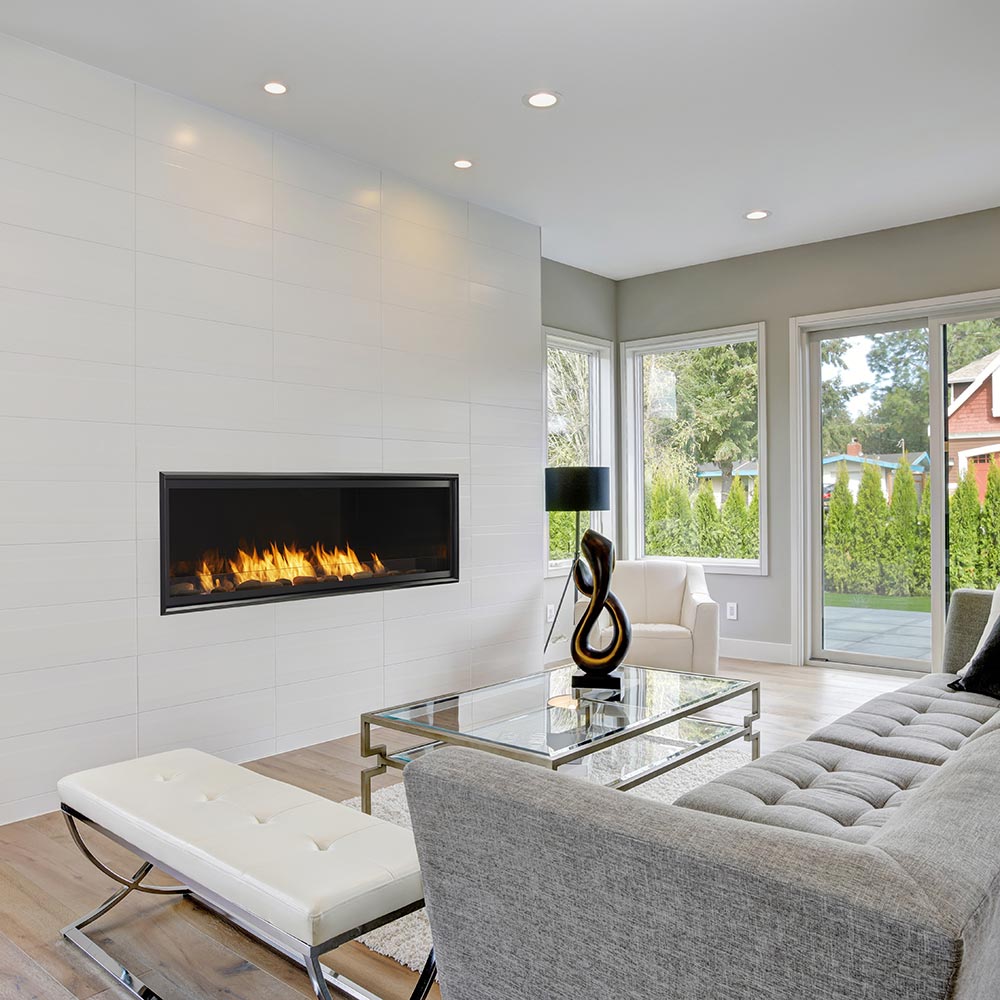 Wall-mounted vent-free gas fireplace insert with black trim and flames