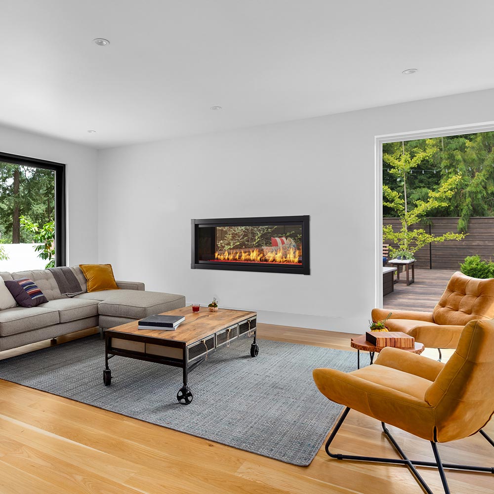 Vent-free see-through gas fireplace with black frame, flame bed visible in wall opening