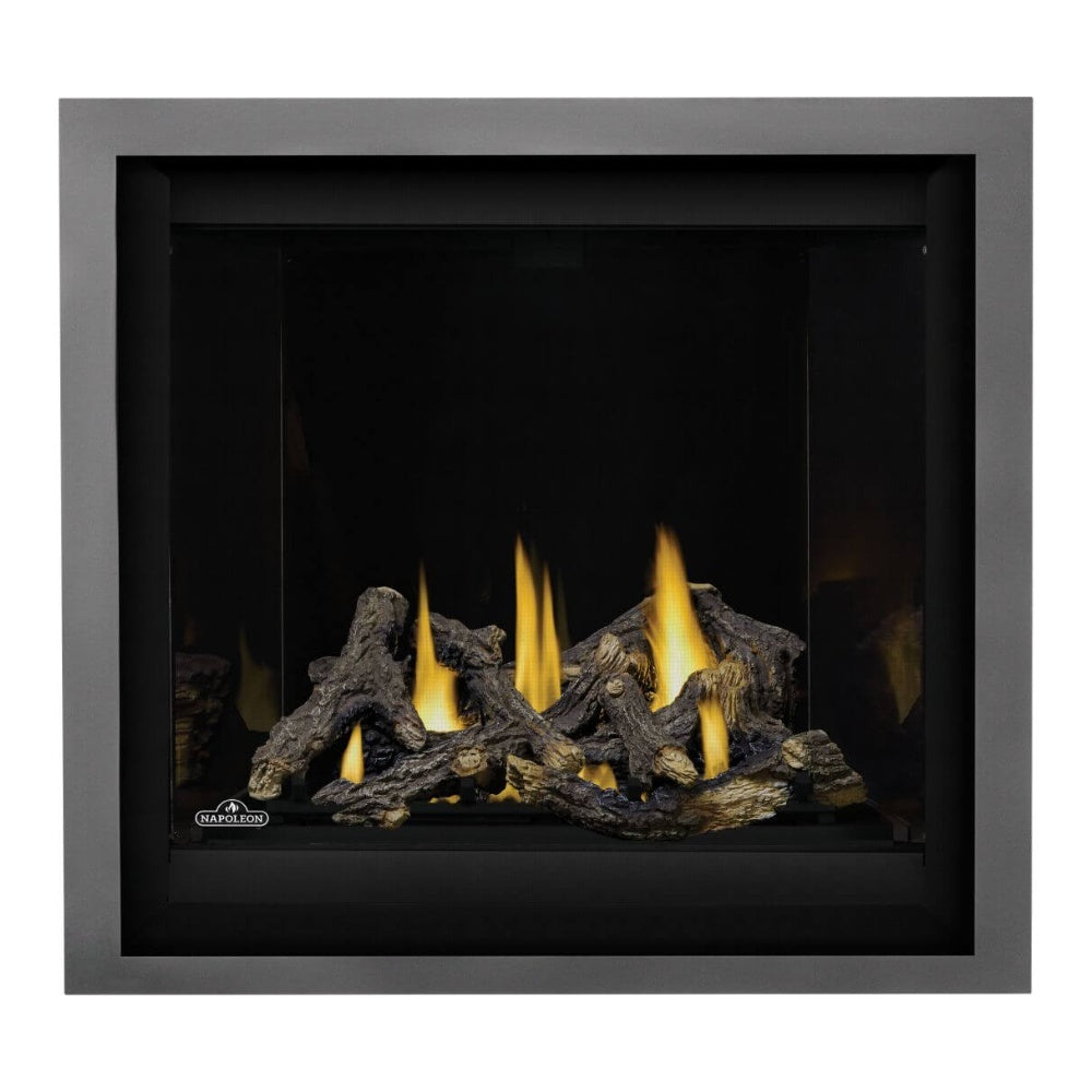 Direct vent gas fireplace with black surround and bright yellow flames over dark logs