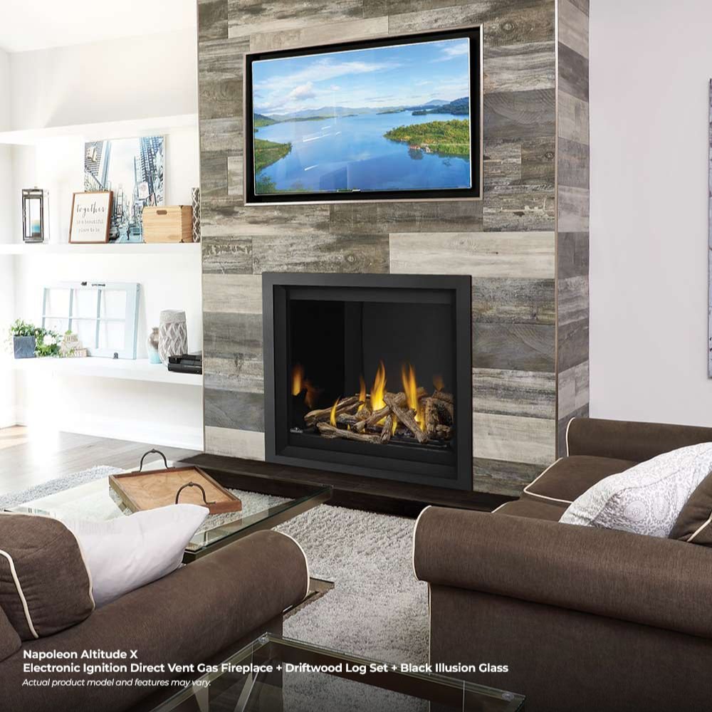 In-wall gas fireplace with black frame and clear glass, burning yellow flames over dark logs