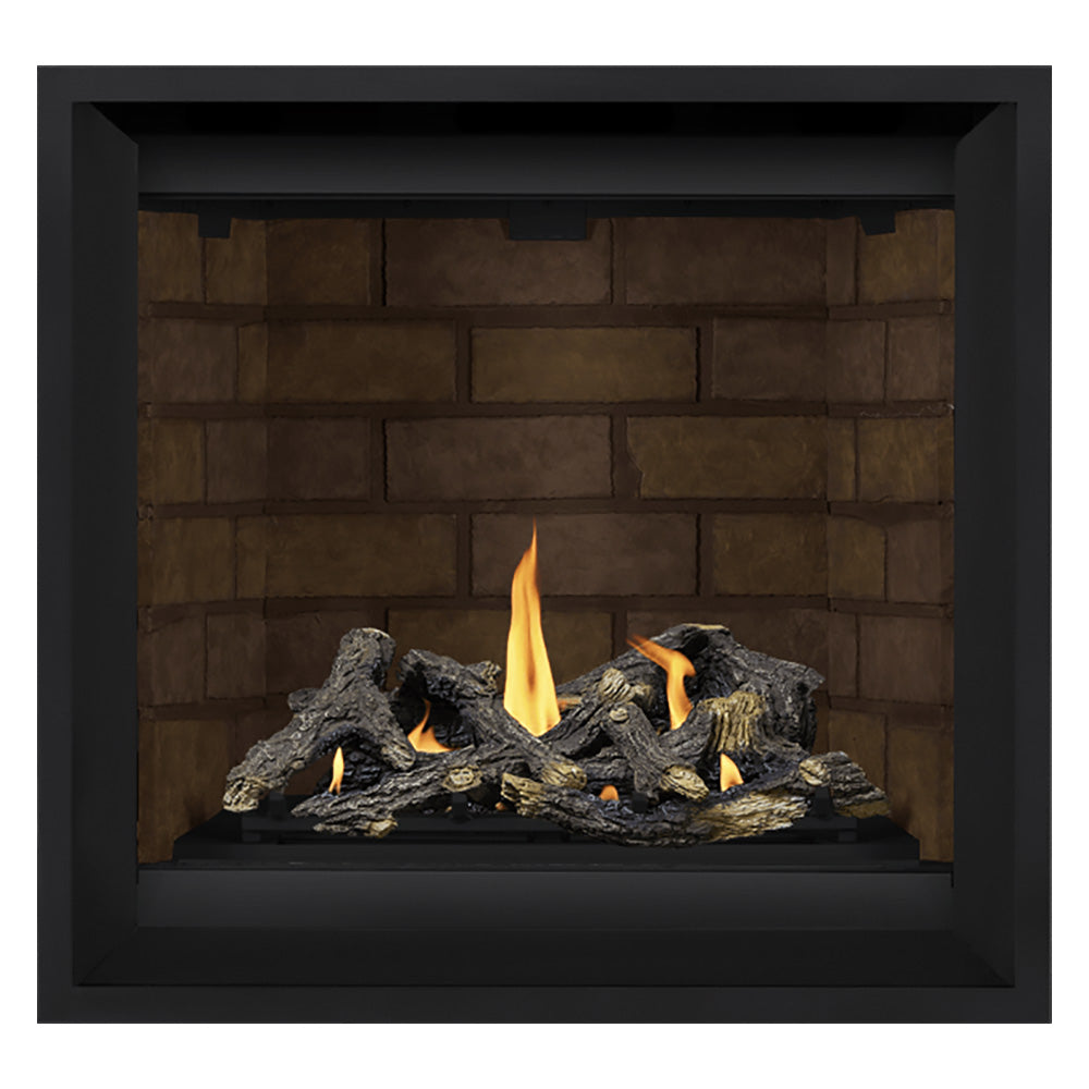 Black gas fireplace with burning logs against tan brick back panel
