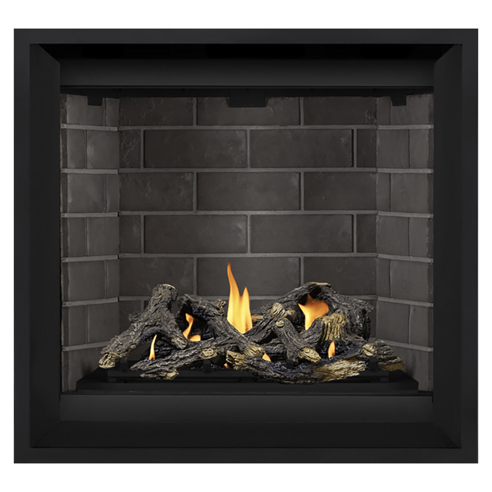 Black gas fireplace with gray brick back panel and burning logs