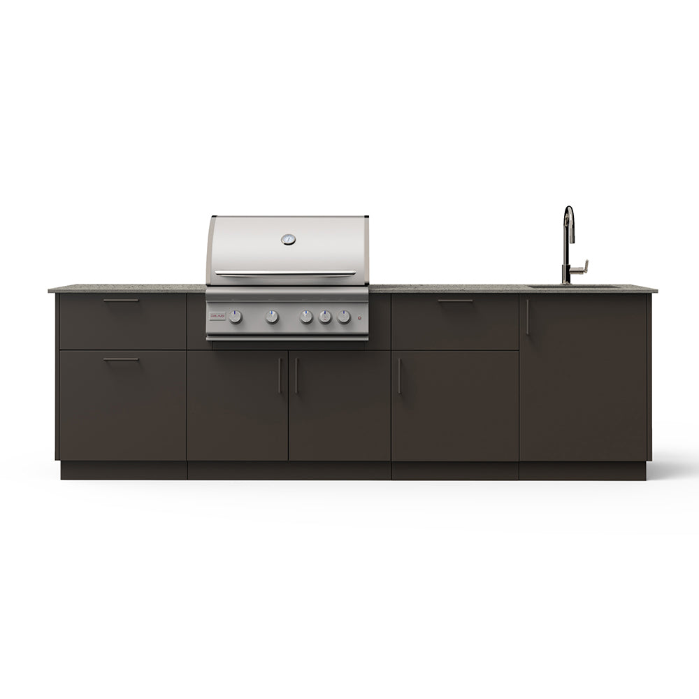 Outdoor kitchen island with dark cabinets, built-in grill with control knobs, and faucet