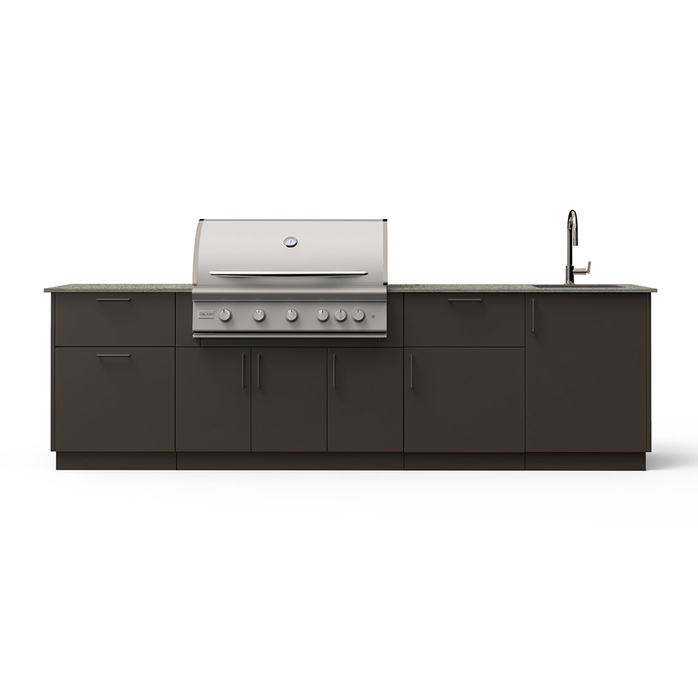 Outdoor kitchen island with stainless grill, sink faucet, and dark base cabinets