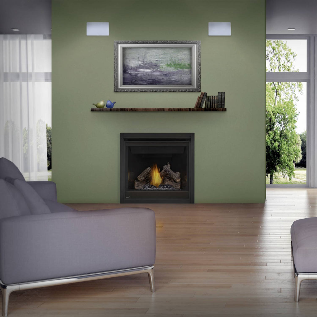 Gas fireplace in a living room with black surround and small flame inside firebox.