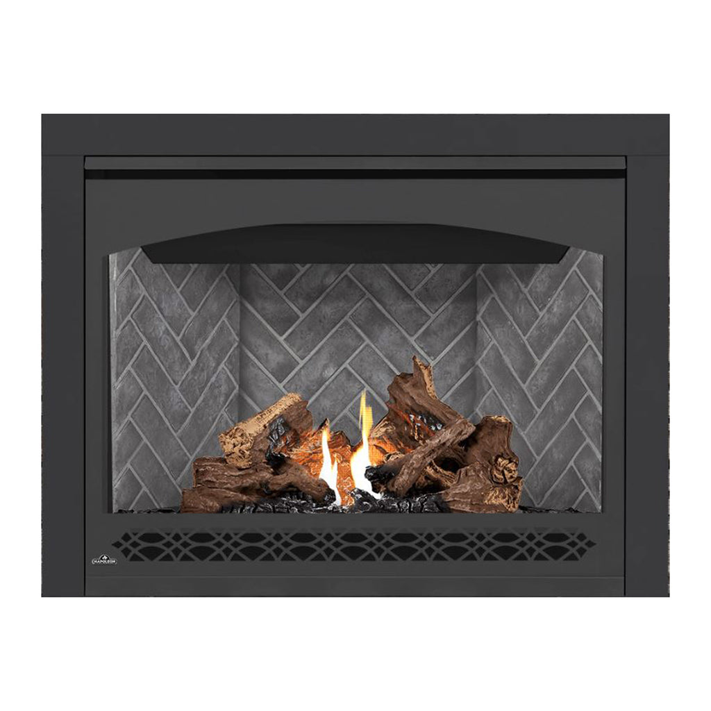 Direct vent gas fireplace with dark frame and burning logs against gray brick back
