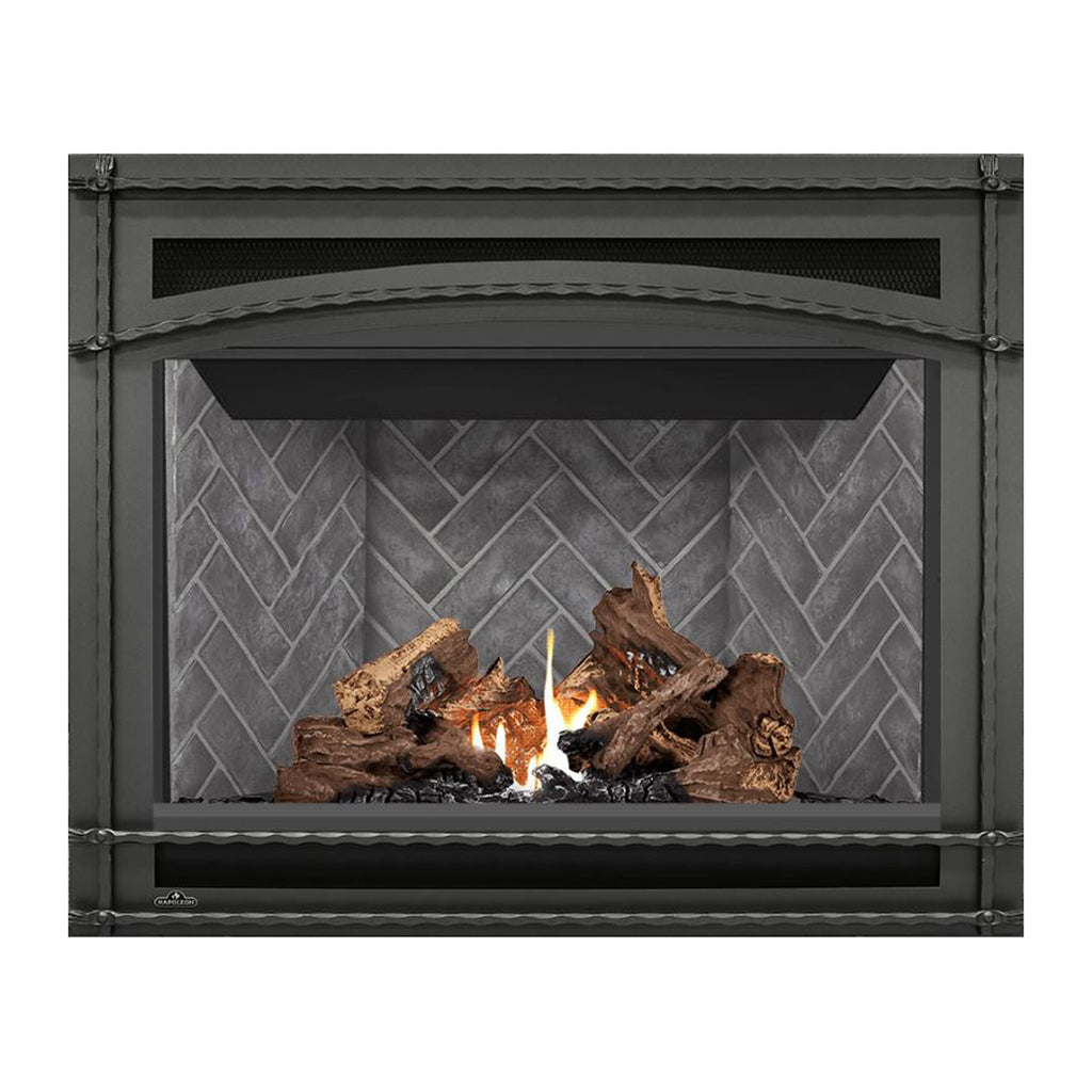 Direct-vent gas fireplace in close view with burning logs behind gray brick-pattern glass.