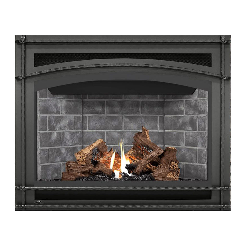 Direct vent gas fireplace with black frame, burning logs and orange flames on dark gray brick