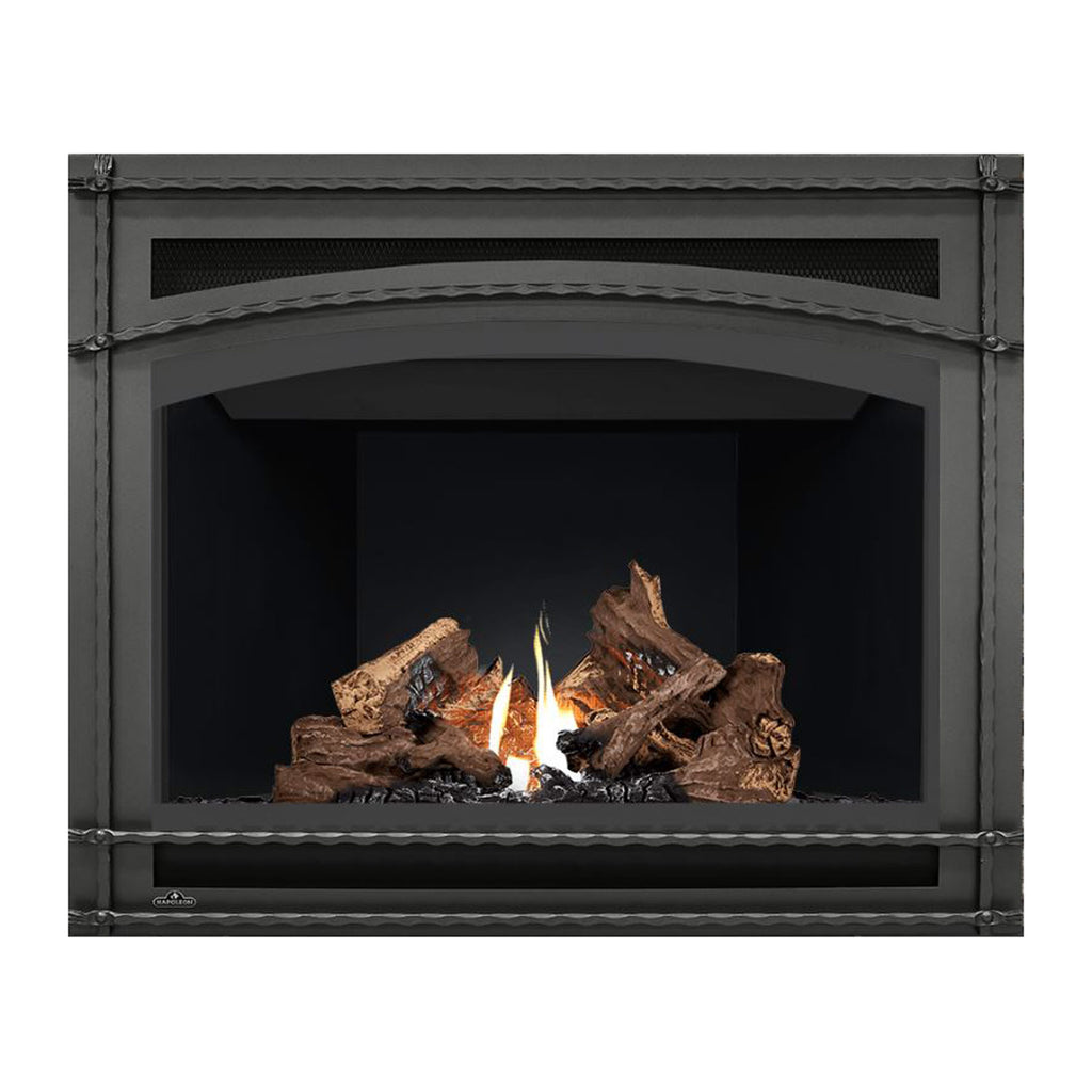 Direct vent gas fireplace view with dark interior, burning logs, and perforated vent panel