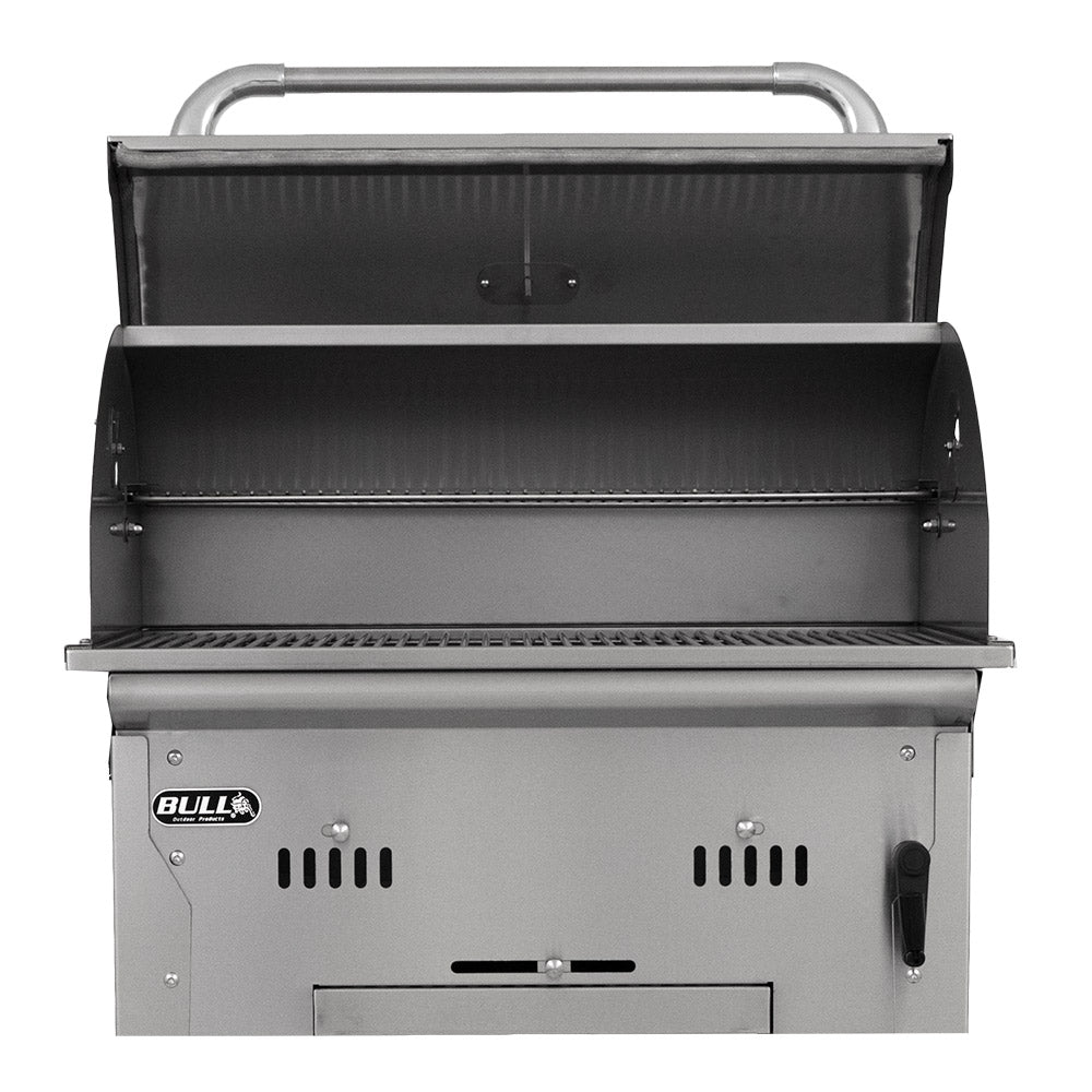 Open charcoal grill with firebox interior and cooking grates beneath warming rack