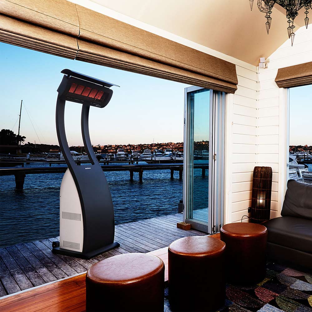 Tungsten portable radiant heater on outdoor patio with glowing upper burner panel