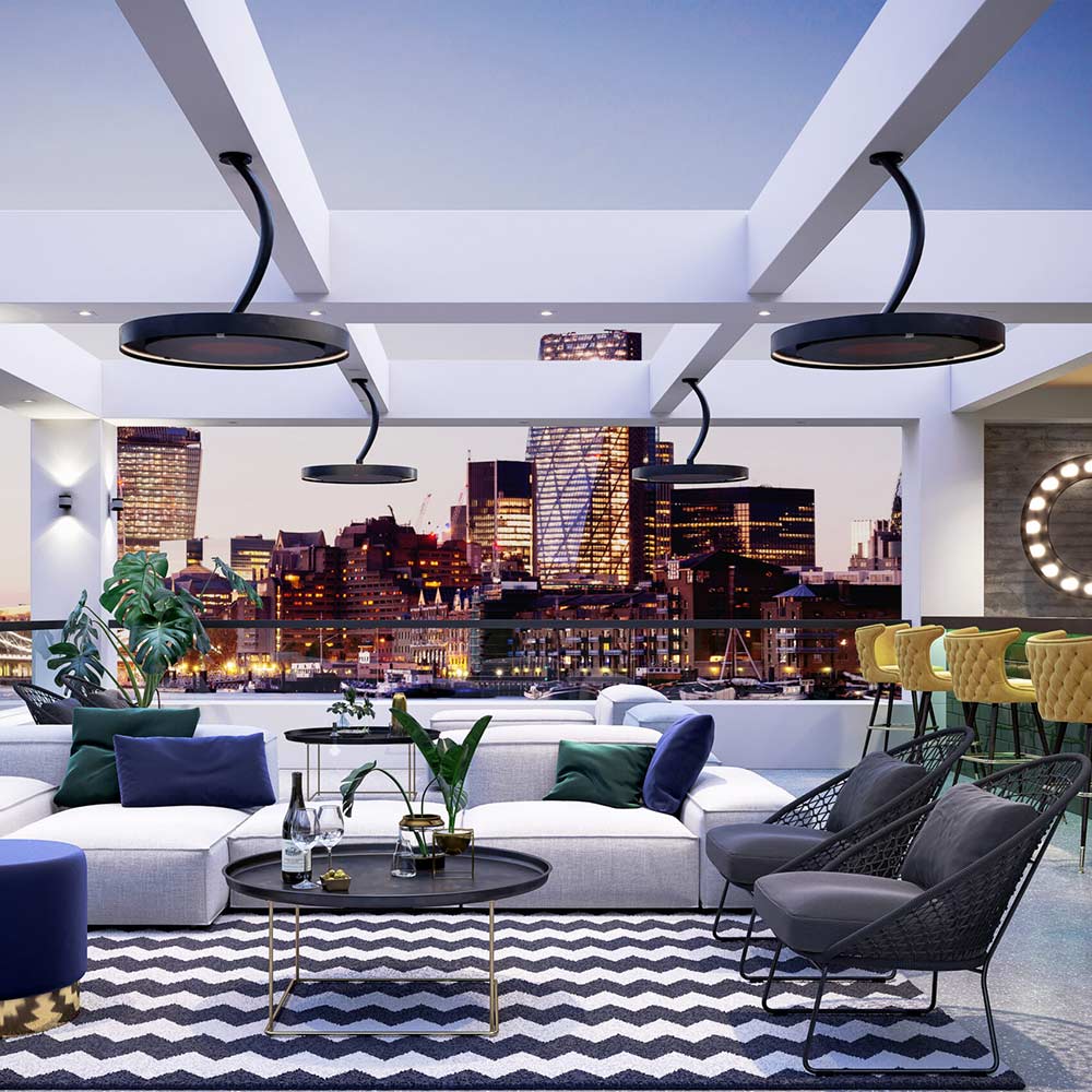 Black pendant electric heater heads with red heating glows under a covered terrace