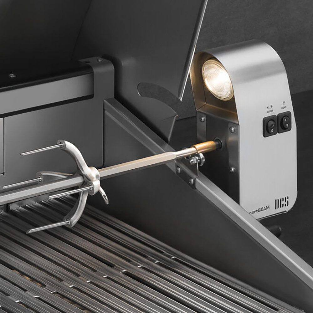 Rotisserie spit on a built-in gas grill with side control panel and stainless side handle