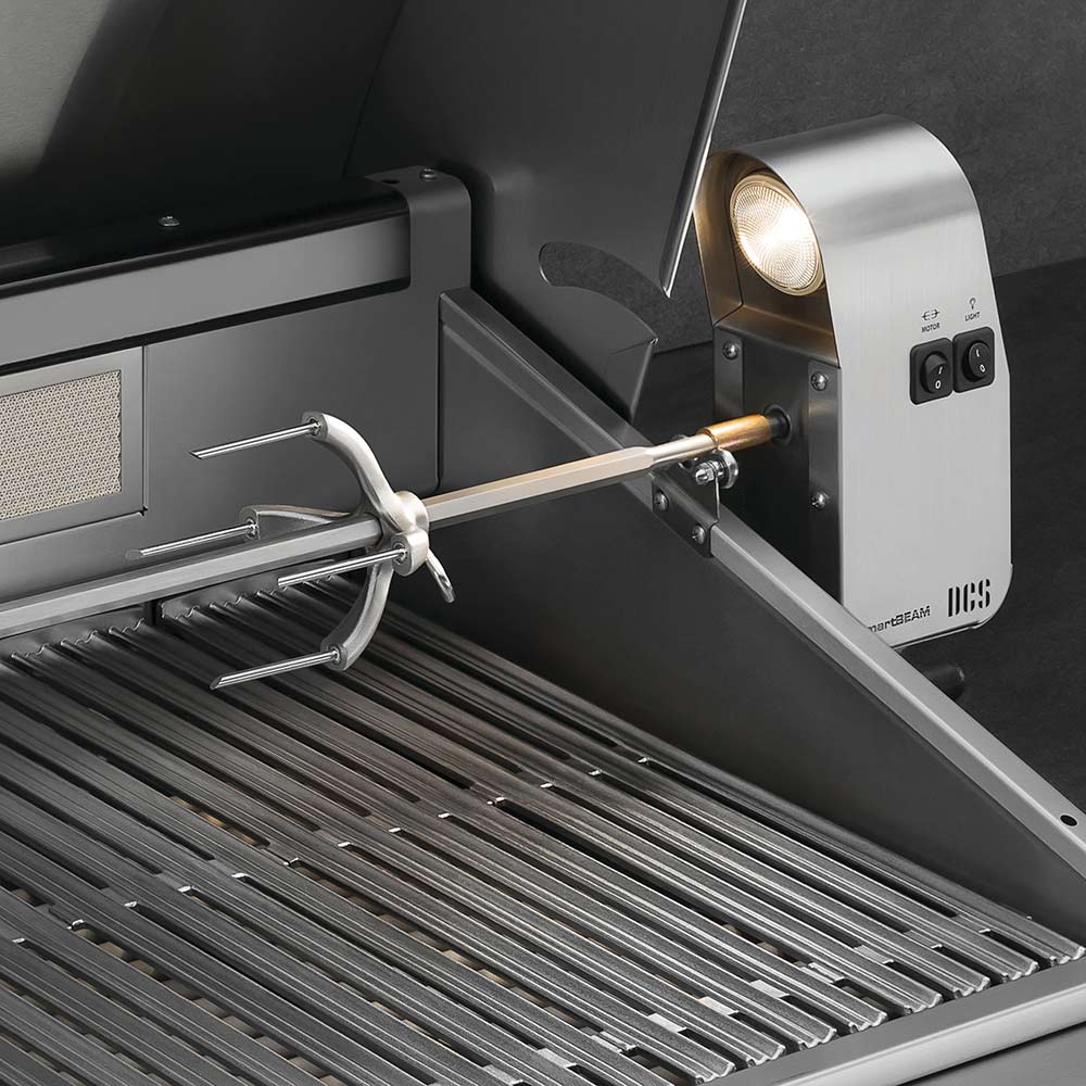 Built-in gas grill with stainless cooking grates, rotisserie rod, and control panel